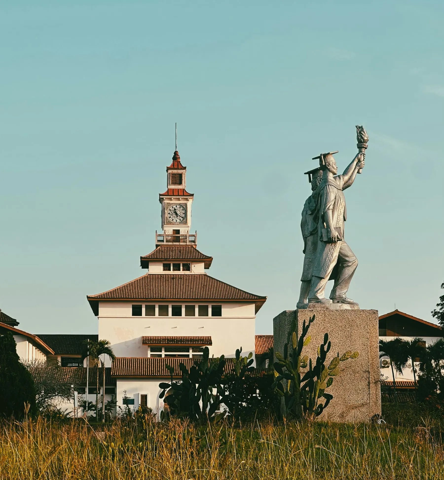 The clock tower and graduate statue at the University of Ghana, Legon